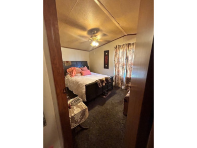 Nice and Open 3 bedroom 2 bath Manufactured home. Large backyard on Mountain Creek Golf Club in Texas - for sale on GolfHomes.com, golf home, golf lot