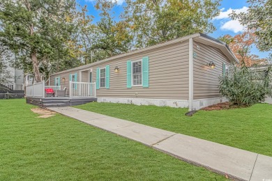 This very open and spacious 4-Bedroom, 2 Bath beach house is on Prestwick Country Club in South Carolina - for sale on GolfHomes.com, golf home, golf lot
