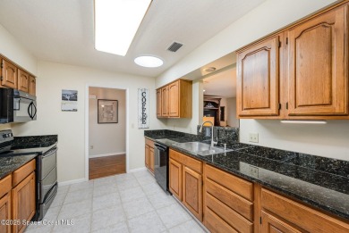 Beautiful expanded Raleigh model with water, golf course, and on Indian River Colony Club in Florida - for sale on GolfHomes.com, golf home, golf lot