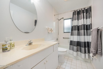 Beautiful expanded Raleigh model with water, golf course, and on Indian River Colony Club in Florida - for sale on GolfHomes.com, golf home, golf lot