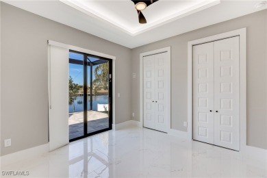 This stunning new construction home offers the perfect blend of on Royal Tee Country Club in Florida - for sale on GolfHomes.com, golf home, golf lot