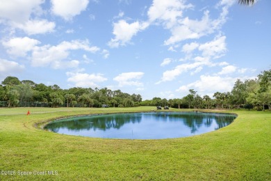 Beautiful expanded Raleigh model with water, golf course, and on Indian River Colony Club in Florida - for sale on GolfHomes.com, golf home, golf lot