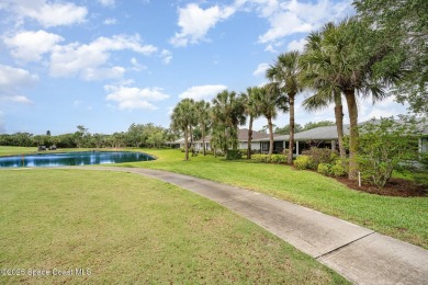 Beautiful expanded Raleigh model with water, golf course, and on Indian River Colony Club in Florida - for sale on GolfHomes.com, golf home, golf lot