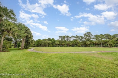 Beautiful expanded Raleigh model with water, golf course, and on Indian River Colony Club in Florida - for sale on GolfHomes.com, golf home, golf lot
