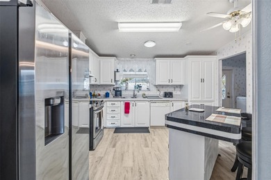 Check out this beautiful, 55+ community that is full of trees on Rivard Golf and Country Club in Florida - for sale on GolfHomes.com, golf home, golf lot