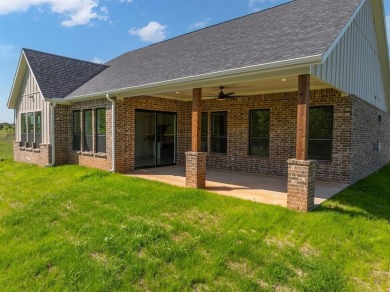 Welcome to 22202 Field Street - A Distinguished Retreat in White on White Bluff Resort - New Course in Texas - for sale on GolfHomes.com, golf home, golf lot