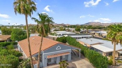 Turn-key home in guard-gated Fountain of the Sun! Situated on an on Fountain of the Sun Country Club in Arizona - for sale on GolfHomes.com, golf home, golf lot