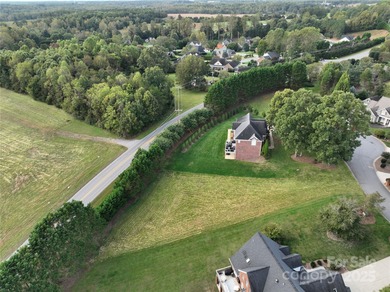 Large, cleared, gently sloping lot in prestigious Rock Barn on Rock Barn Golf and Spa in North Carolina - for sale on GolfHomes.com, golf home, golf lot