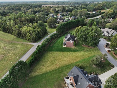 Large, cleared, gently sloping lot in prestigious Rock Barn on Rock Barn Golf and Spa in North Carolina - for sale on GolfHomes.com, golf home, golf lot