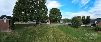 Large, cleared, gently sloping lot in prestigious Rock Barn on Rock Barn Golf and Spa in North Carolina - for sale on GolfHomes.com, golf home, golf lot