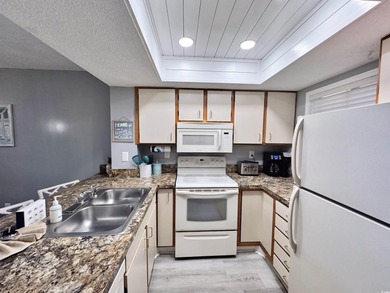 Welcome to coastal living at its best in this 2-bedroom, 2-bath on The Dunes Golf and Beach Club in South Carolina - for sale on GolfHomes.com, golf home, golf lot