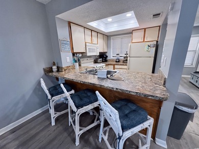 Welcome to coastal living at its best in this 2-bedroom, 2-bath on The Dunes Golf and Beach Club in South Carolina - for sale on GolfHomes.com, golf home, golf lot