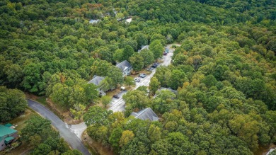 This stunning, updated studio is tucked away among the trees on on Mountain Ranch Golf Club in Arkansas - for sale on GolfHomes.com, golf home, golf lot