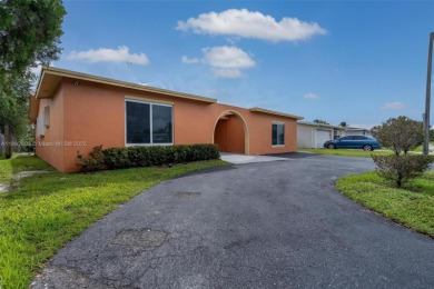 Welcome to your waterfront oasis in Sunrise Golf Village! This on Sunrise Lakes Phase III in Florida - for sale on GolfHomes.com, golf home, golf lot