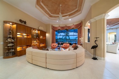 Sweeping water and fairway views abound in this custom-built on Boca Royale Golf and Country Club in Florida - for sale on GolfHomes.com, golf home, golf lot
