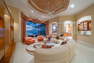 Sweeping water and fairway views abound in this custom-built on Boca Royale Golf and Country Club in Florida - for sale on GolfHomes.com, golf home, golf lot