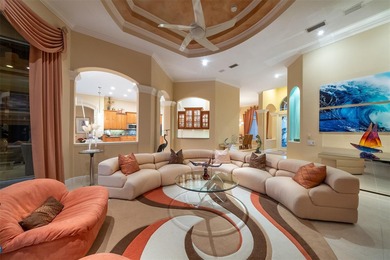 Sweeping water and fairway views abound in this custom-built on Boca Royale Golf and Country Club in Florida - for sale on GolfHomes.com, golf home, golf lot