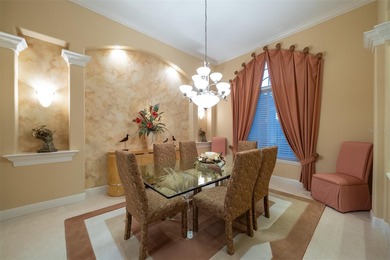 Sweeping water and fairway views abound in this custom-built on Boca Royale Golf and Country Club in Florida - for sale on GolfHomes.com, golf home, golf lot