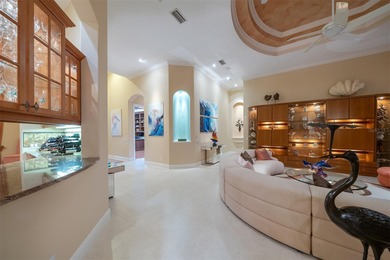 Sweeping water and fairway views abound in this custom-built on Boca Royale Golf and Country Club in Florida - for sale on GolfHomes.com, golf home, golf lot