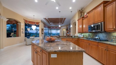 Sweeping water and fairway views abound in this custom-built on Boca Royale Golf and Country Club in Florida - for sale on GolfHomes.com, golf home, golf lot