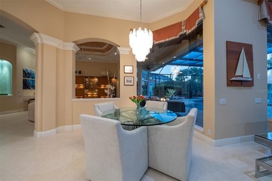 Sweeping water and fairway views abound in this custom-built on Boca Royale Golf and Country Club in Florida - for sale on GolfHomes.com, golf home, golf lot