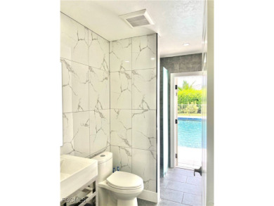 Modern Elegance Meets Florida Living in Imperial Golf Estates! on Imperial Golf Club in Florida - for sale on GolfHomes.com, golf home, golf lot