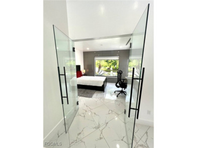 Modern Elegance Meets Florida Living in Imperial Golf Estates! on Imperial Golf Club in Florida - for sale on GolfHomes.com, golf home, golf lot
