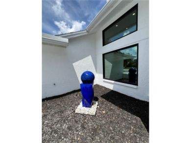 Modern Elegance Meets Florida Living in Imperial Golf Estates! on Imperial Golf Club in Florida - for sale on GolfHomes.com, golf home, golf lot