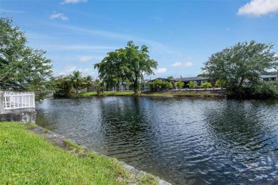 Welcome to your waterfront oasis in Sunrise Golf Village! This on Sunrise Lakes Phase III in Florida - for sale on GolfHomes.com, golf home, golf lot
