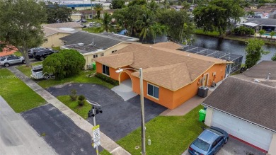 Welcome to your waterfront oasis in Sunrise Golf Village! This on Sunrise Lakes Phase III in Florida - for sale on GolfHomes.com, golf home, golf lot