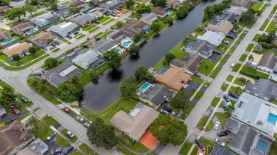 Welcome to your waterfront oasis in Sunrise Golf Village! This on Sunrise Lakes Phase III in Florida - for sale on GolfHomes.com, golf home, golf lot