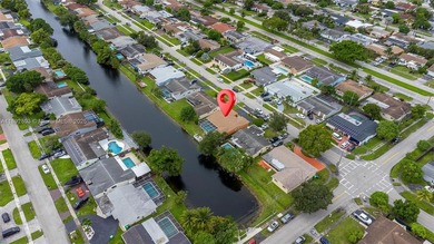 Welcome to your waterfront oasis in Sunrise Golf Village! This on Sunrise Lakes Phase III in Florida - for sale on GolfHomes.com, golf home, golf lot