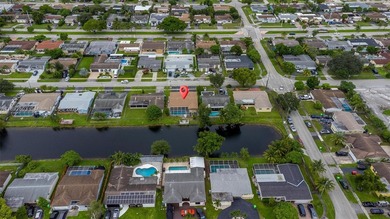 Welcome to your waterfront oasis in Sunrise Golf Village! This on Sunrise Lakes Phase III in Florida - for sale on GolfHomes.com, golf home, golf lot