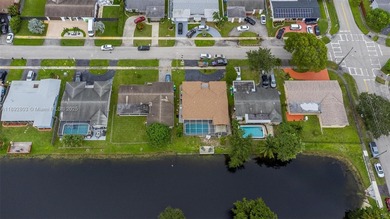Welcome to your waterfront oasis in Sunrise Golf Village! This on Sunrise Lakes Phase III in Florida - for sale on GolfHomes.com, golf home, golf lot