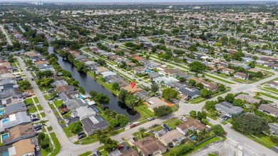 Welcome to your waterfront oasis in Sunrise Golf Village! This on Sunrise Lakes Phase III in Florida - for sale on GolfHomes.com, golf home, golf lot