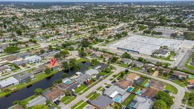 Welcome to your waterfront oasis in Sunrise Golf Village! This on Sunrise Lakes Phase III in Florida - for sale on GolfHomes.com, golf home, golf lot