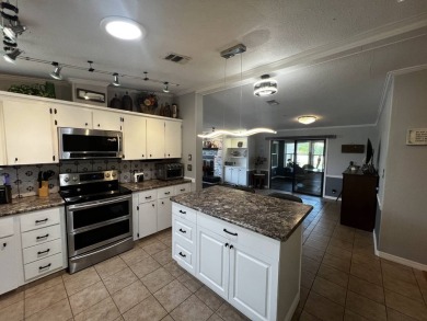 This beautifully updated 2-bedroom, 2-bathroom unfurnished home on Lake Henry Golf Club in Florida - for sale on GolfHomes.com, golf home, golf lot