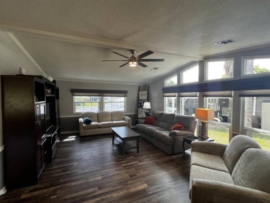 This beautifully updated 2-bedroom, 2-bathroom unfurnished home on Lake Henry Golf Club in Florida - for sale on GolfHomes.com, golf home, golf lot