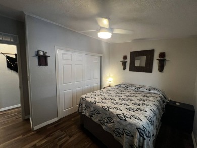 This beautifully updated 2-bedroom, 2-bathroom unfurnished home on Lake Henry Golf Club in Florida - for sale on GolfHomes.com, golf home, golf lot