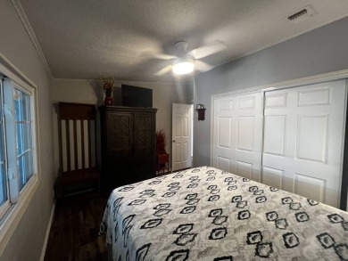 This beautifully updated 2-bedroom, 2-bathroom unfurnished home on Lake Henry Golf Club in Florida - for sale on GolfHomes.com, golf home, golf lot