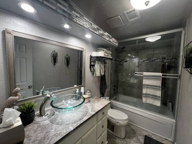 This beautifully updated 2-bedroom, 2-bathroom unfurnished home on Lake Henry Golf Club in Florida - for sale on GolfHomes.com, golf home, golf lot