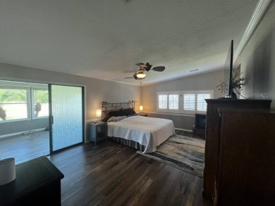 This beautifully updated 2-bedroom, 2-bathroom unfurnished home on Lake Henry Golf Club in Florida - for sale on GolfHomes.com, golf home, golf lot