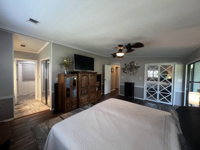 This beautifully updated 2-bedroom, 2-bathroom unfurnished home on Lake Henry Golf Club in Florida - for sale on GolfHomes.com, golf home, golf lot