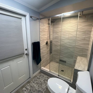 This beautifully updated 2-bedroom, 2-bathroom unfurnished home on Lake Henry Golf Club in Florida - for sale on GolfHomes.com, golf home, golf lot