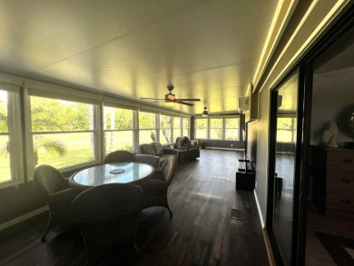 This beautifully updated 2-bedroom, 2-bathroom unfurnished home on Lake Henry Golf Club in Florida - for sale on GolfHomes.com, golf home, golf lot