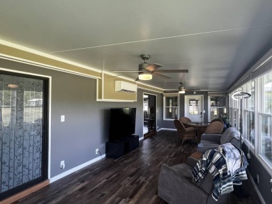 This beautifully updated 2-bedroom, 2-bathroom unfurnished home on Lake Henry Golf Club in Florida - for sale on GolfHomes.com, golf home, golf lot