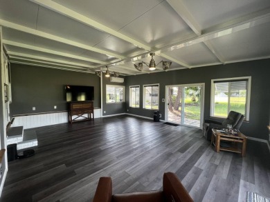 This beautifully updated 2-bedroom, 2-bathroom unfurnished home on Lake Henry Golf Club in Florida - for sale on GolfHomes.com, golf home, golf lot