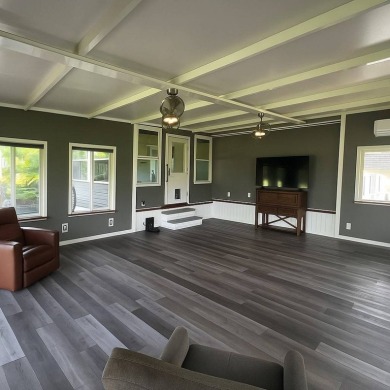 This beautifully updated 2-bedroom, 2-bathroom unfurnished home on Lake Henry Golf Club in Florida - for sale on GolfHomes.com, golf home, golf lot