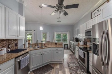 One-of-a-kind, renovated modern look home on the water in highly on Indian Bayou Golf and Country Club in Florida - for sale on GolfHomes.com, golf home, golf lot