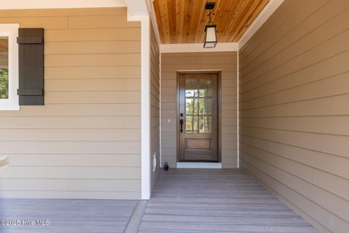 Welcome to your dream home in the premier lake and golf on Beacon Ridge Golf and Country Club in North Carolina - for sale on GolfHomes.com, golf home, golf lot